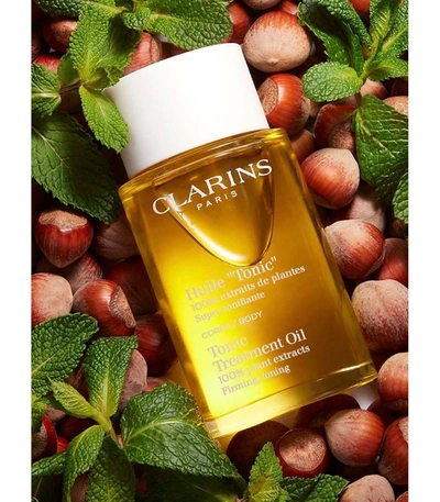 Shop Clarins Tonic Body Treatment Oil In Yellow