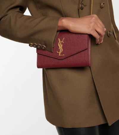 Shop Saint Laurent Uptown Leather Clutch In Red