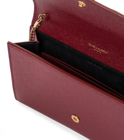 Shop Saint Laurent Uptown Leather Clutch In Red