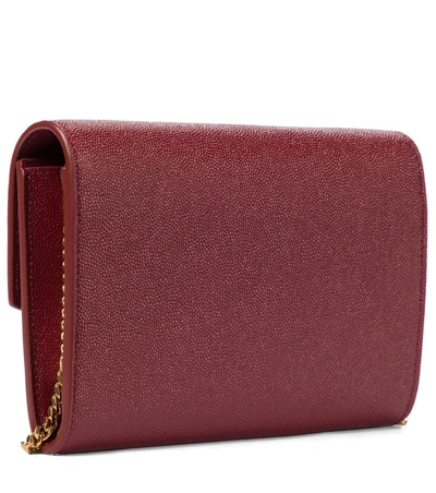 Shop Saint Laurent Uptown Leather Clutch In Red