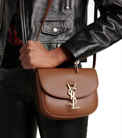 Shop Saint Laurent Kaia Small Leather Crossbody Bag In Brown