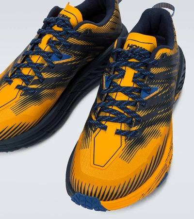 Shop Hoka One One Speedgoat 4 Sneakers In Yellow