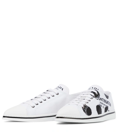 Shop Prada Printed Canvas Sneakers In White