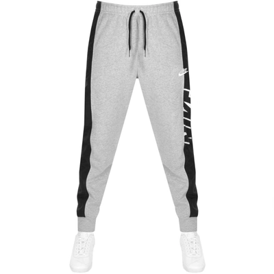 Shop Nike Logo Jogging Bottoms Grey