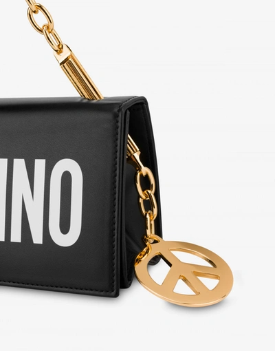 Shop Moschino Handbag With Logo And Charms In Black