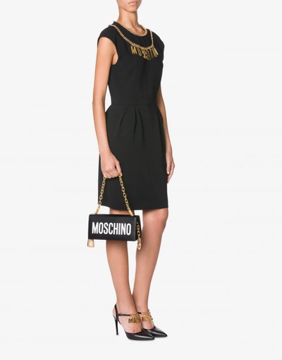 Shop Moschino Handbag With Logo And Charms In Black