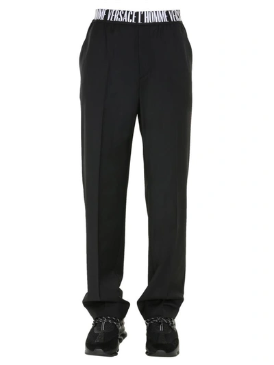 Shop Versace Wool Trousers In Black