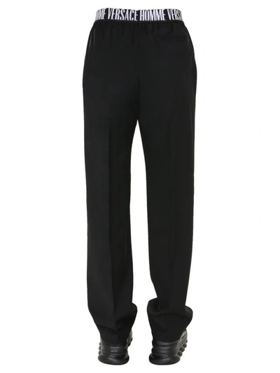 Shop Versace Wool Trousers In Black