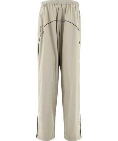 Shop Balenciaga Slouchy Track Pants In Green