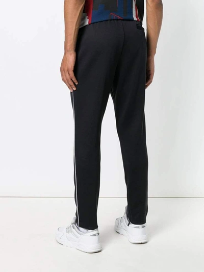 Shop Valentino Trousers Black