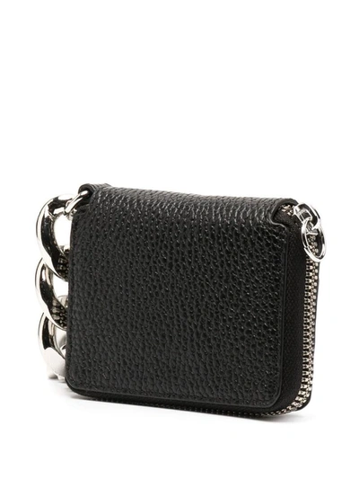 Shop Kara Crossbody Wallet In Hammered Leather In Black
