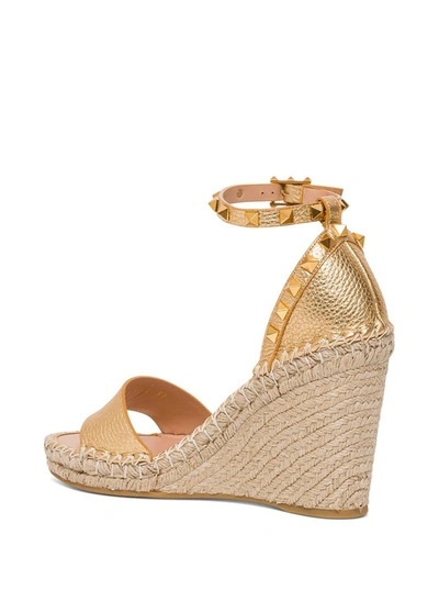 Shop Valentino Rockstud Double Wedge Sandal In Laminated Leather In Metallic
