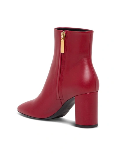 Shop Saint Laurent Lou 70 Leather Ankle Boots In Red