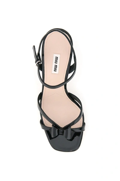 Shop Miu Miu Patent Leather Bow Sandals In Nero