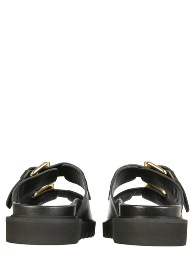 Shop Moschino Sandals With Buckles In Black