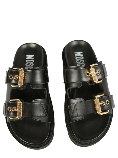 Shop Moschino Sandals With Buckles In Black