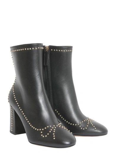 Shop Boutique Moschino Studded Ankle Boots In Black