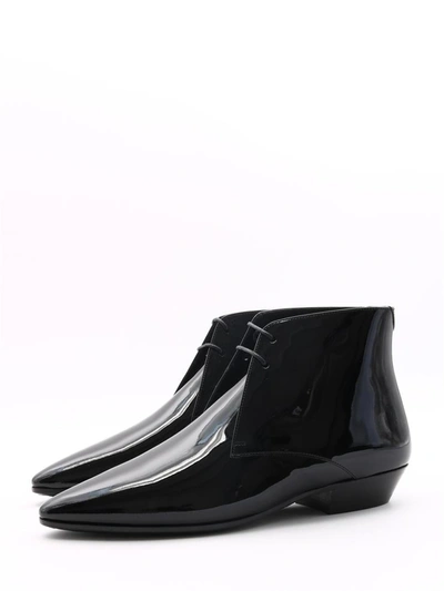 Shop Saint Laurent Patent Jonas Ankle Boots In Black