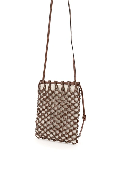 Shop Burberry Drawstring A Mesh Crossbody Bag In Tan