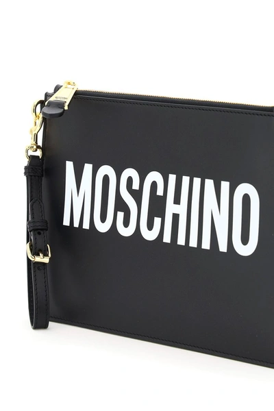 Shop Moschino Logo Print Clutch In Fantasia Nero