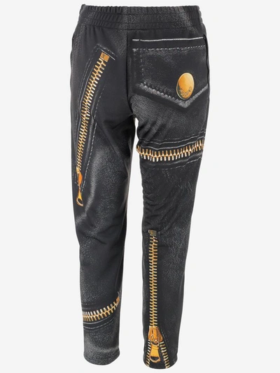 Shop Moschino Trousers In Nero