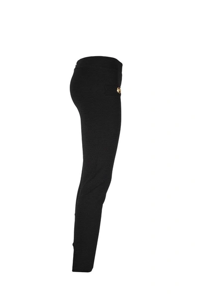 Shop Balmain Knit Leggings With Gold-tone Buttons In Black