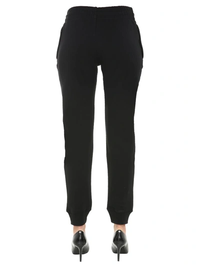 Shop Moschino Jogging Pants In Black