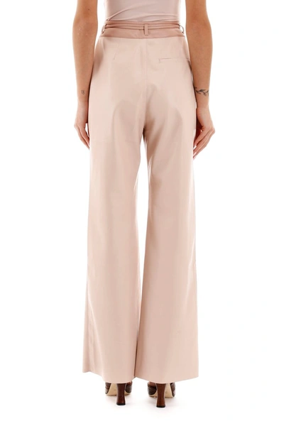 Shop Nanushka Faux Leather Trousers In Blush Patchwork