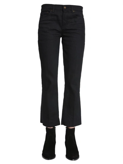 Shop Saint Laurent Cropped Raw Edge Jeans In Black