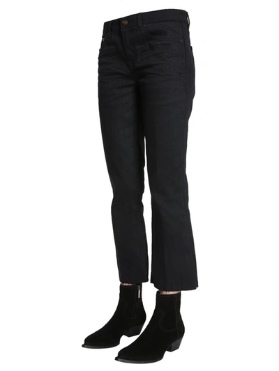 Shop Saint Laurent Cropped Raw Edge Jeans In Black