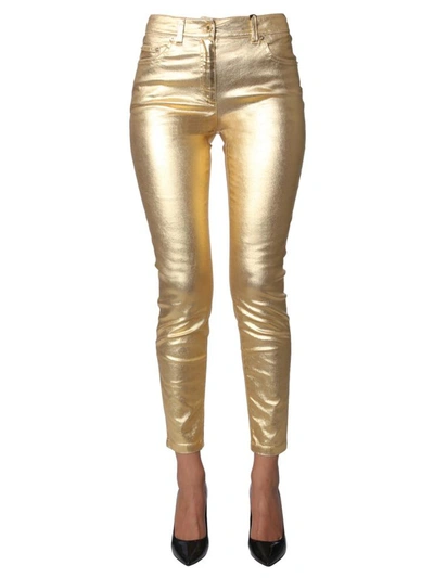 Shop Moschino Bull Trousers In Gold