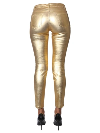 Shop Moschino Bull Trousers In Gold