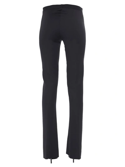 Shop Versace Flared Trousers In Black