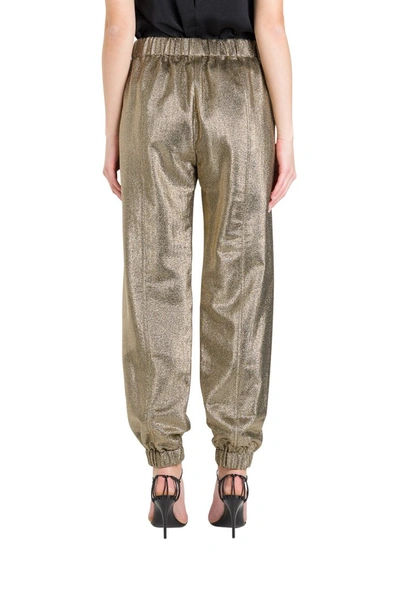 Shop Saint Laurent Gold Foil Trousers In Metallic