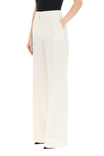 Shop Dolce & Gabbana Flare Wool Trousers In Bianco Naturale