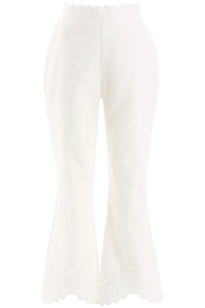 Shop Zimmermann Carnaby Flared Trousers In Ivory