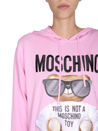 Shop Moschino Hooded Dress In Pink