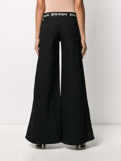 Shop Palm Angels Jeans Black