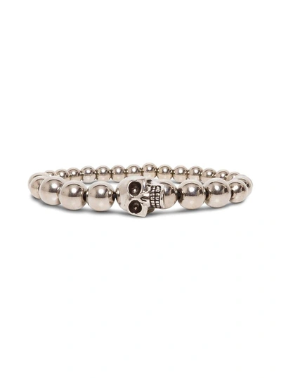 Shop Alexander Mcqueen Skull Bracelet In Metallic