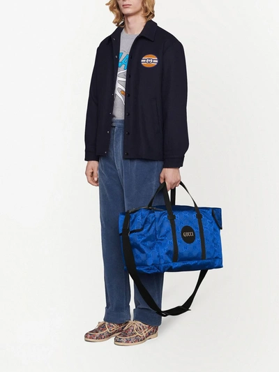 Shop Gucci Off The Grid Gg Supreme Duffle Bag In Blue
