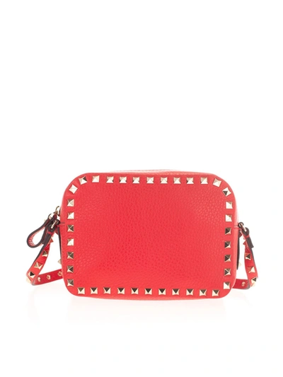 Shop Valentino Rockstud Crossbody Bag In Pur Rouge In Red