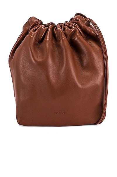 Jil sander drawstring small crossbody online bag