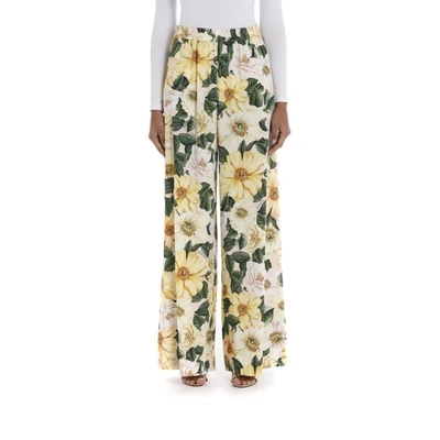 Shop Dolce & Gabbana Flared Camellia-print Cady Pants In Ah Camelie Giallo F Rosa