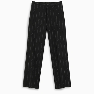 Shop Balenciaga Logoed Baggy Trousers In Black