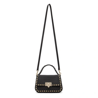 Shop Valentino Black  Garavani Small Rockstud Top Handle Bag In 0no Black