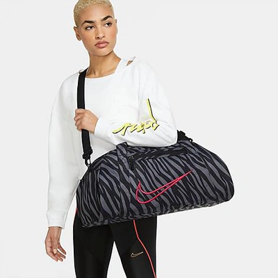 Shop Nike Women's Gym Club Printed Training Duffel Bag In Black/fireberry