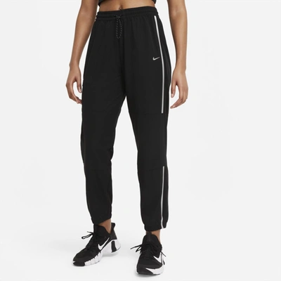 Shop Nike Pro Women's Woven Pants In Black,metallic Silver