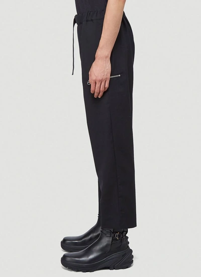 Shop Oamc Tapered Pants In Black