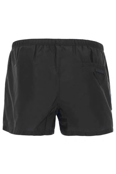 Shop Prada Logo Patch Swim Shorts In Black