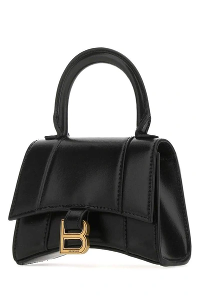 Shop Balenciaga Mini Hourglass Top Handle Bag In Black
